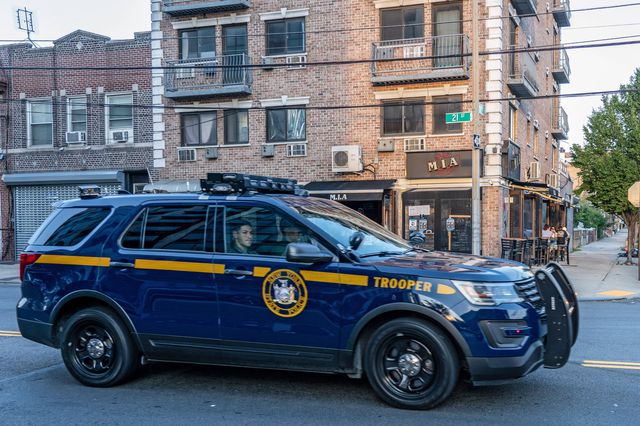A police car drives past a M.I.A Restaurant Lounge in Astoria after the State Liquor Authority suspended its liquor license for failing to maintain social distancing in Queens on July 21st, 2020.